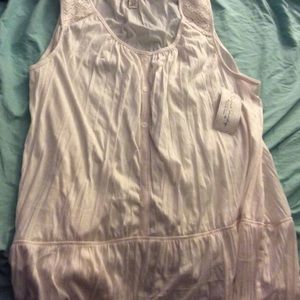 Off white sleeveless blouse.